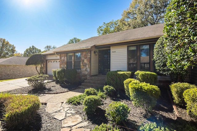 ranch-style home with a garage