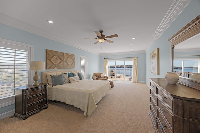 carpeted bedroom featuring access to outside, multiple windows, and ceiling fan