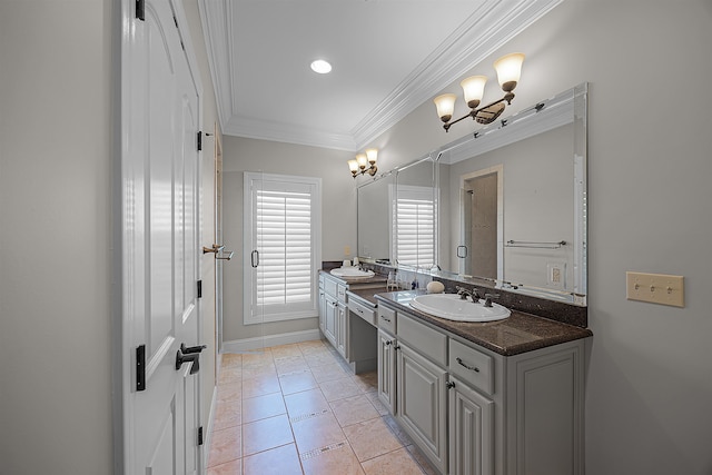 bathroom with ornamental molding, vanity, and tile patterned floors