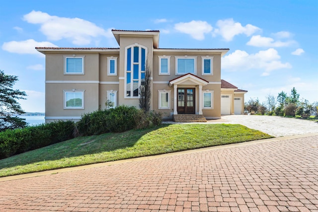 view of front of property featuring french doors and a front yard