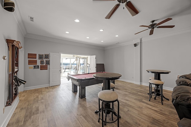 playroom with light wood-type flooring, ceiling fan, ornamental molding, and pool table