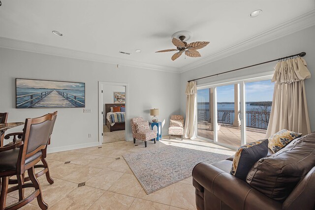 living room with ornamental molding, a water view, ceiling fan, and light tile patterned flooring