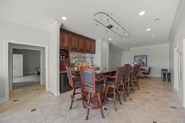 interior space with ornamental molding, stone counters, tasteful backsplash, and light tile patterned flooring