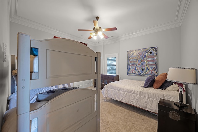 carpeted bedroom featuring ceiling fan and ornamental molding