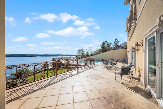 view of patio / terrace with a water view