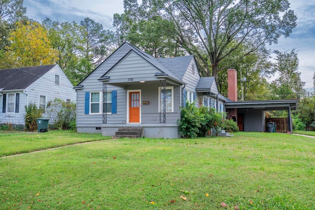 bungalow-style house with a front lawn and a carport