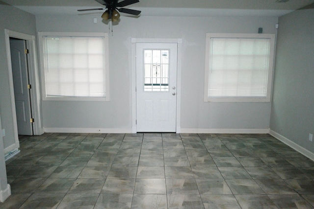 entryway with a wealth of natural light and ceiling fan