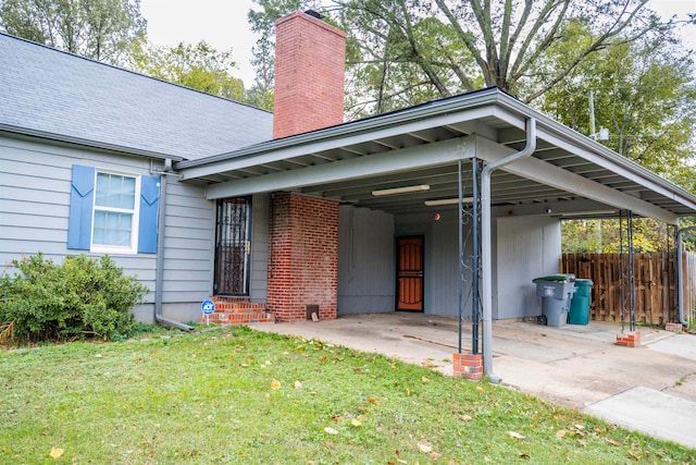 view of front of house with a front yard and a carport