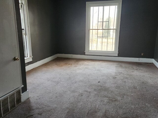 empty room featuring light carpet