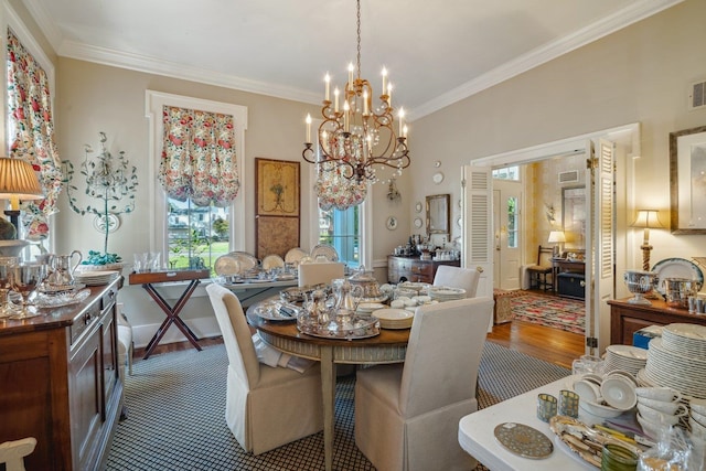 dining area with hardwood / wood-style flooring, a chandelier, and ornamental molding