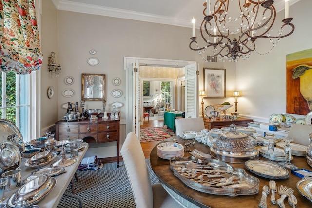 dining room featuring a chandelier and ornamental molding