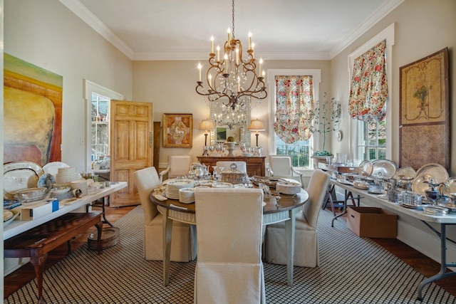 dining area with a chandelier, hardwood / wood-style floors, and crown molding