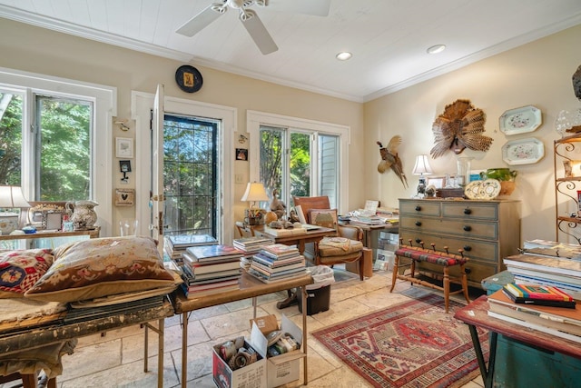 living area featuring ornamental molding, a healthy amount of sunlight, and ceiling fan