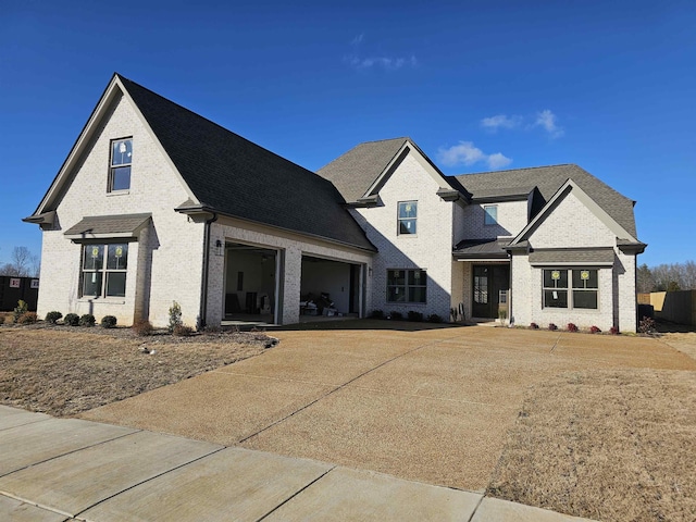 12064 Stromness Cv, Arlington, TN 38002 - view of front of property with concrete driveway, brick siding, and roof with shingles