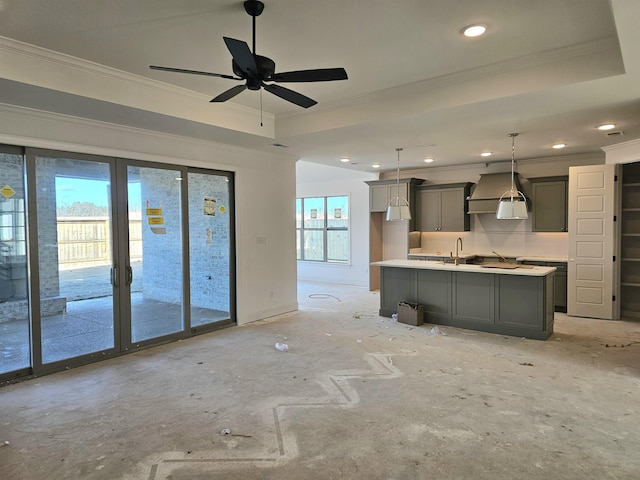 12064 Stromness Cv, Arlington, TN 38002 - kitchen featuring crown molding, custom exhaust hood, gray cabinets, a center island with sink, and recessed lighting