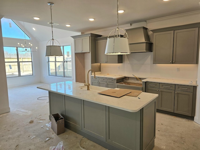 12064 Stromness Cv, Arlington, TN 38002 - kitchen with gray cabinets, premium range hood, lofted ceiling, a kitchen island with sink, and a chandelier