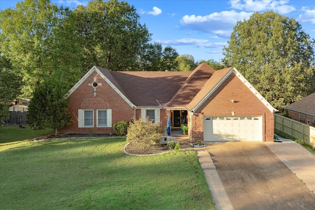 view of front facade with a garage and a front yard