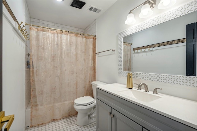 full bathroom with tile patterned floors, vanity, toilet, and shower / bath combination with curtain