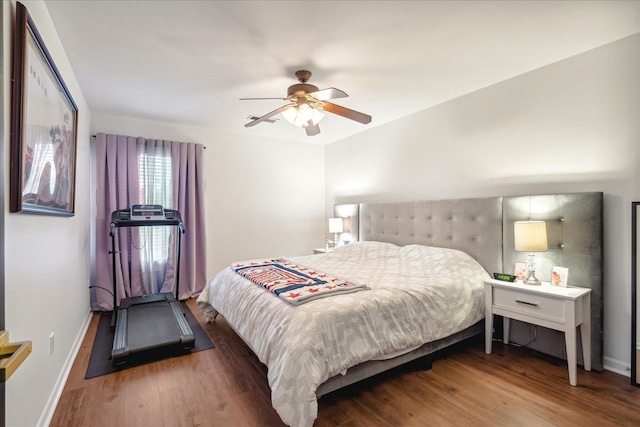 bedroom with hardwood / wood-style flooring and ceiling fan