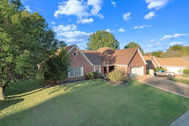 view of front of home featuring a front lawn and a garage