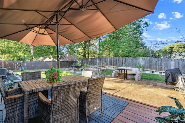 wooden terrace featuring grilling area