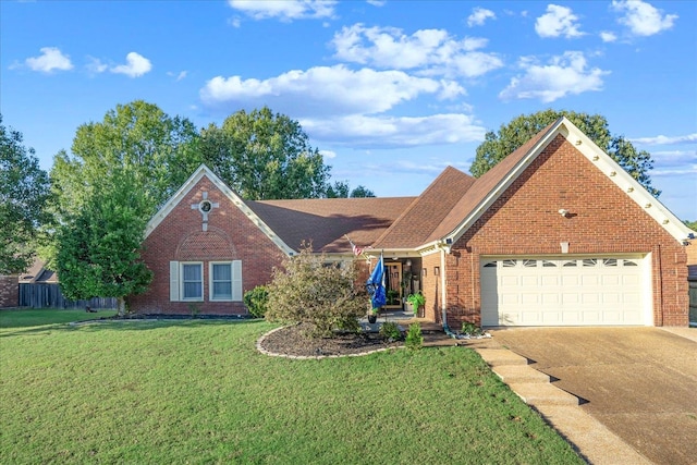 view of front of property with a garage and a front lawn