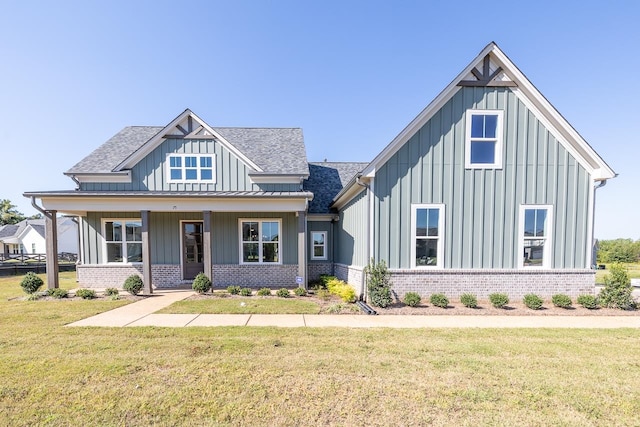 view of front of home featuring a front lawn and a porch