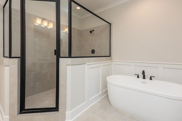 bathroom with plus walk in shower, tile patterned floors, and ornamental molding