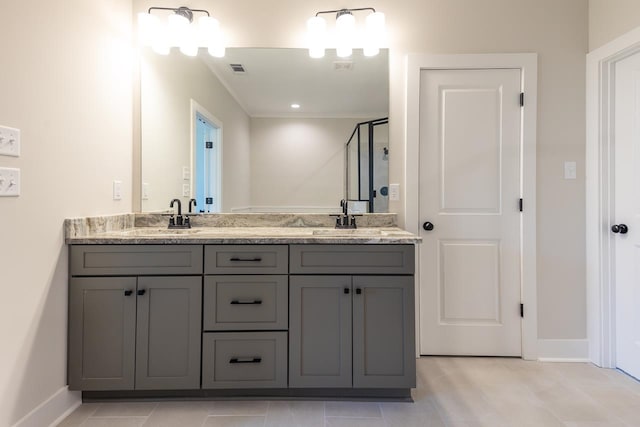 bathroom with vanity, an enclosed shower, and a chandelier