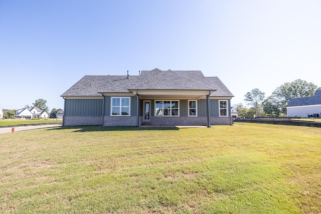 back of house featuring a yard