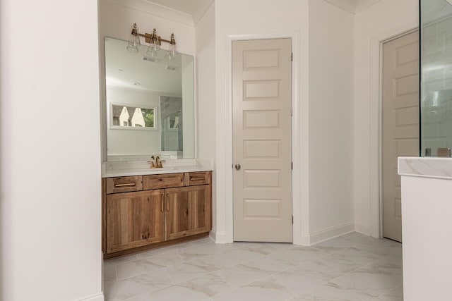 bathroom with a shower with door, vanity, and ornamental molding