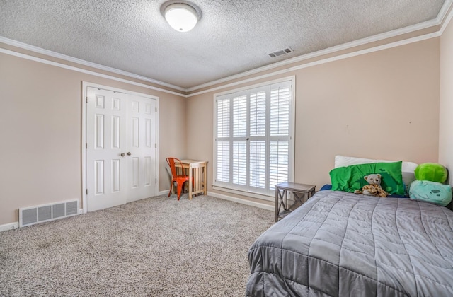 carpeted bedroom featuring a textured ceiling, a closet, and ornamental molding