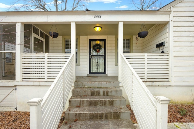 property entrance with covered porch