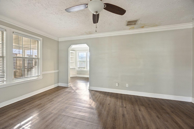 unfurnished room with a textured ceiling, ceiling fan, dark hardwood / wood-style floors, and ornamental molding