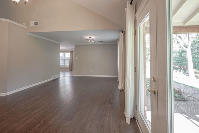 unfurnished room featuring ornamental molding, lofted ceiling, and dark hardwood / wood-style flooring