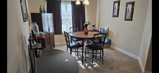 view of carpeted dining space