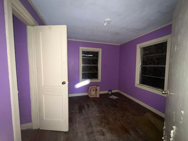 interior space with wood-type flooring and ornamental molding