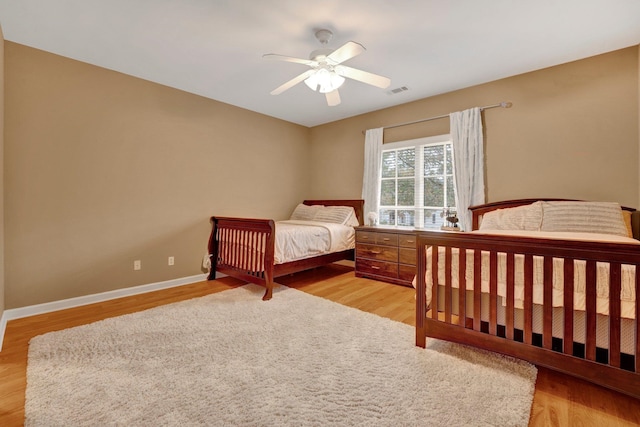 bedroom featuring ceiling fan and light hardwood / wood-style flooring