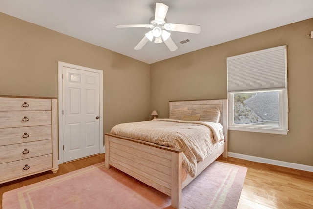 bedroom featuring light wood-type flooring and ceiling fan