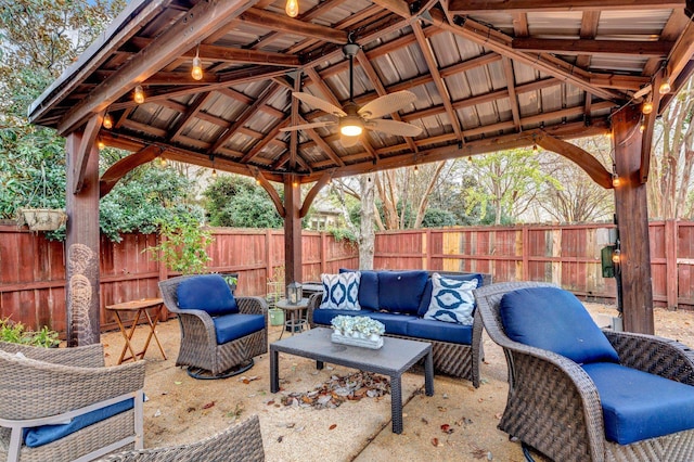 view of patio featuring a gazebo, an outdoor living space, and ceiling fan