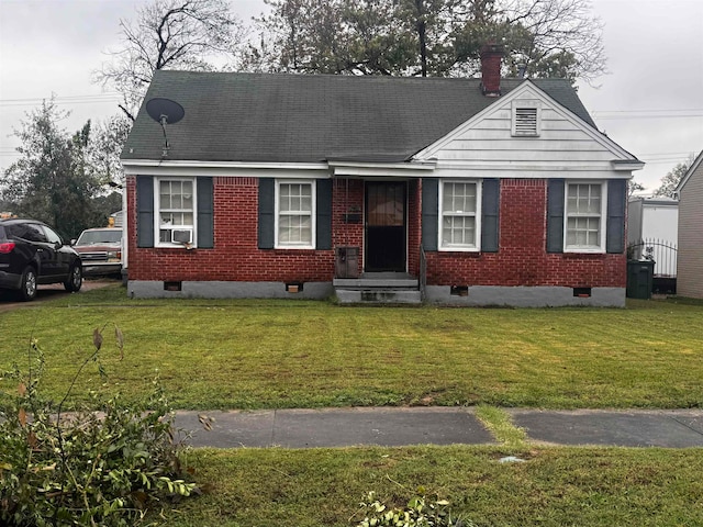 view of front facade featuring cooling unit and a front lawn