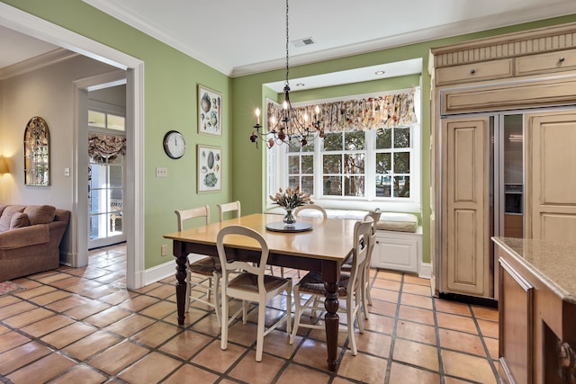 dining area with crown molding, light tile patterned floors, and a chandelier