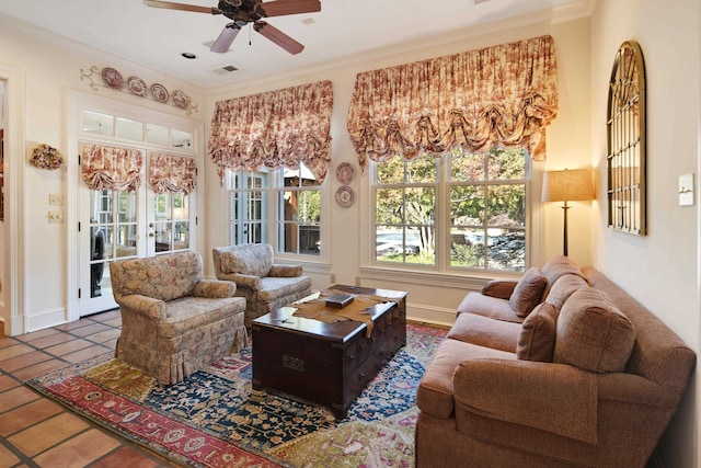 tiled living room featuring ceiling fan and ornamental molding