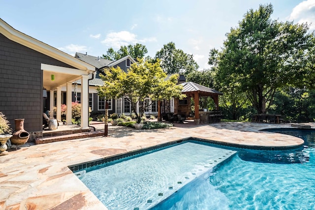 view of swimming pool featuring a gazebo and a patio area