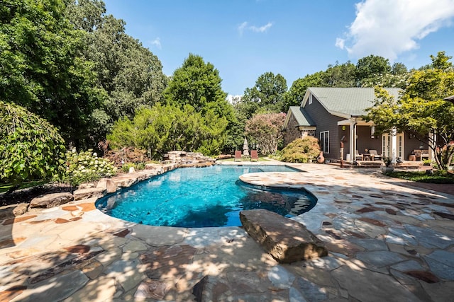 view of swimming pool featuring a patio