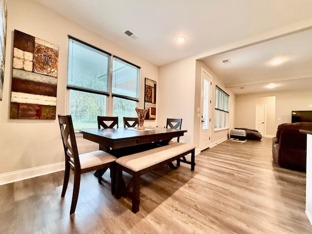 dining space featuring hardwood / wood-style floors