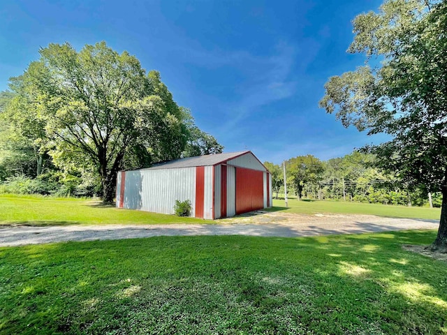 view of outdoor structure with a lawn