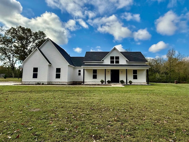 view of front of home with covered porch and a front yard