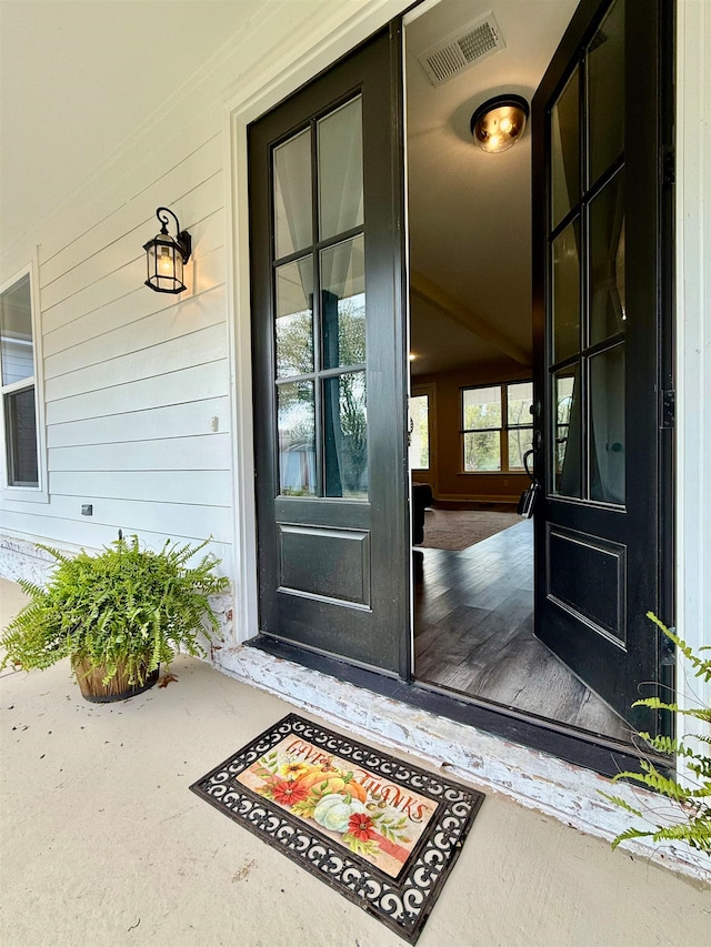 property entrance featuring covered porch