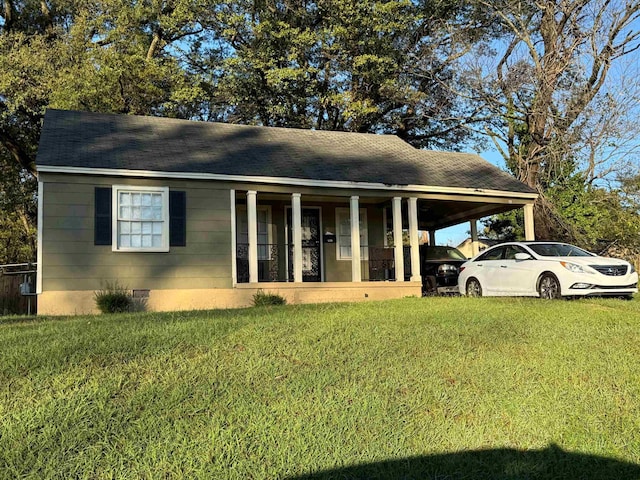 1827 Wellington St, Memphis, TN 38106 - view of front facade with a front lawn, an attached carport, crawl space, and a porch